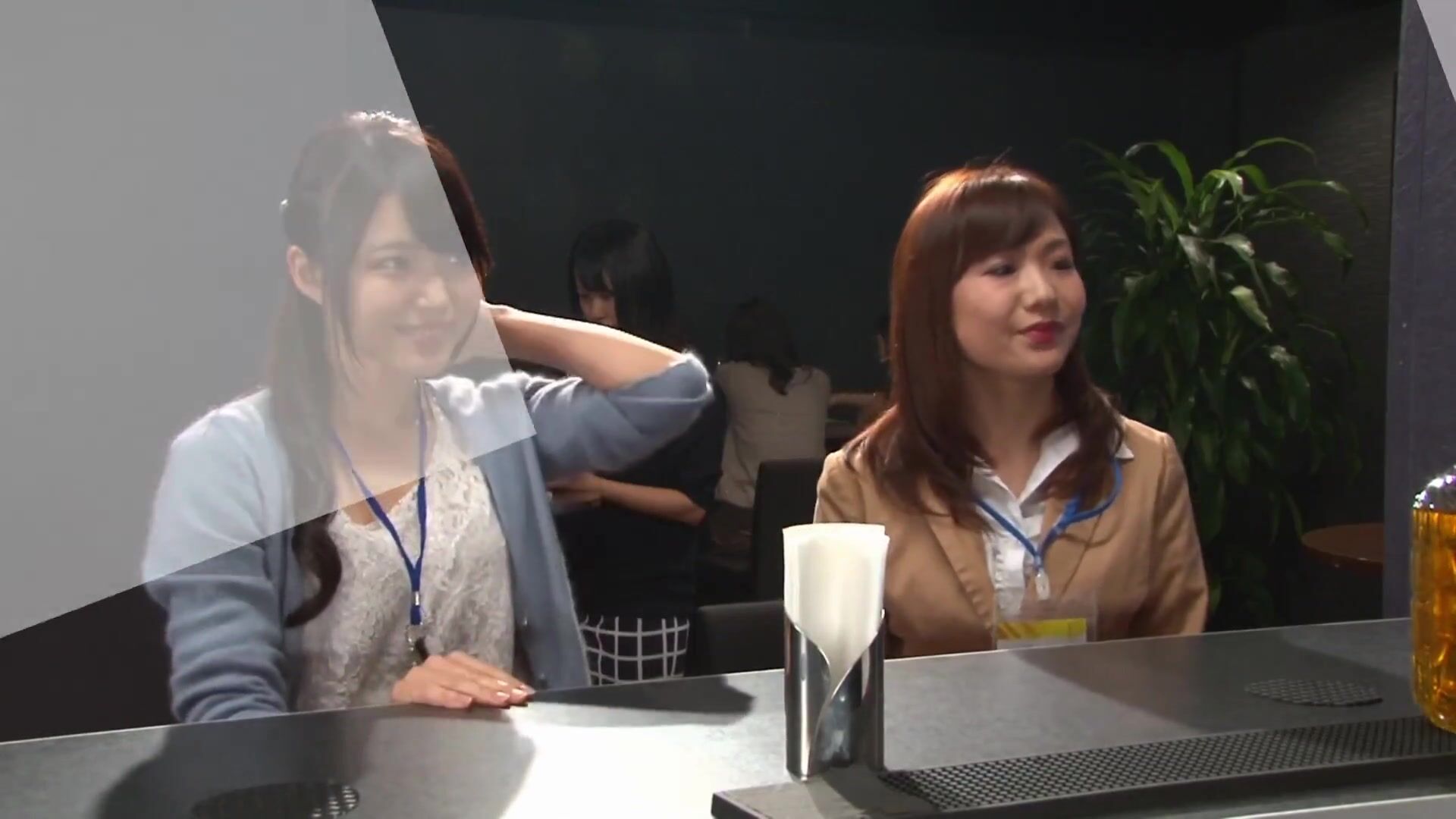 2 coworkers share a quiet drink