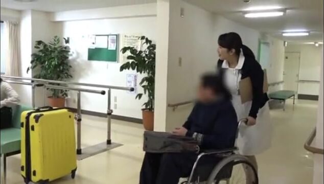 Nurse helps her patient with physiotherapy